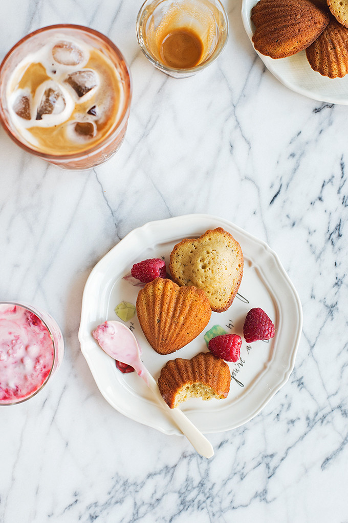 Brown Butter Madeleines--tender, buttery cakes with sweet and tangy smashed raspberry swirled créme fraîche. 