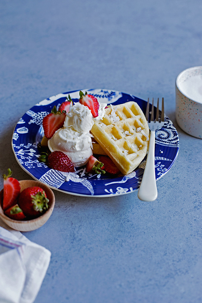 Coconut Oil Waffles | coconut-scented waffles with crisp edges and tender middles, perfect for topping with loads of berries and cream or a generous pour of maple syrup. 